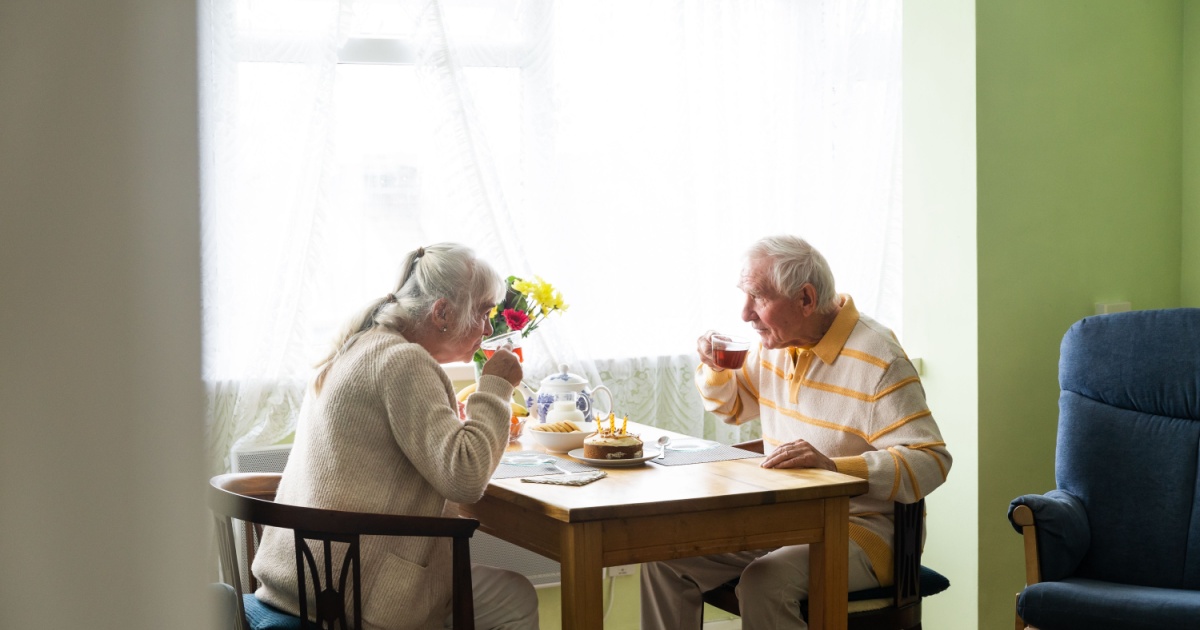 Old couple having breakfast