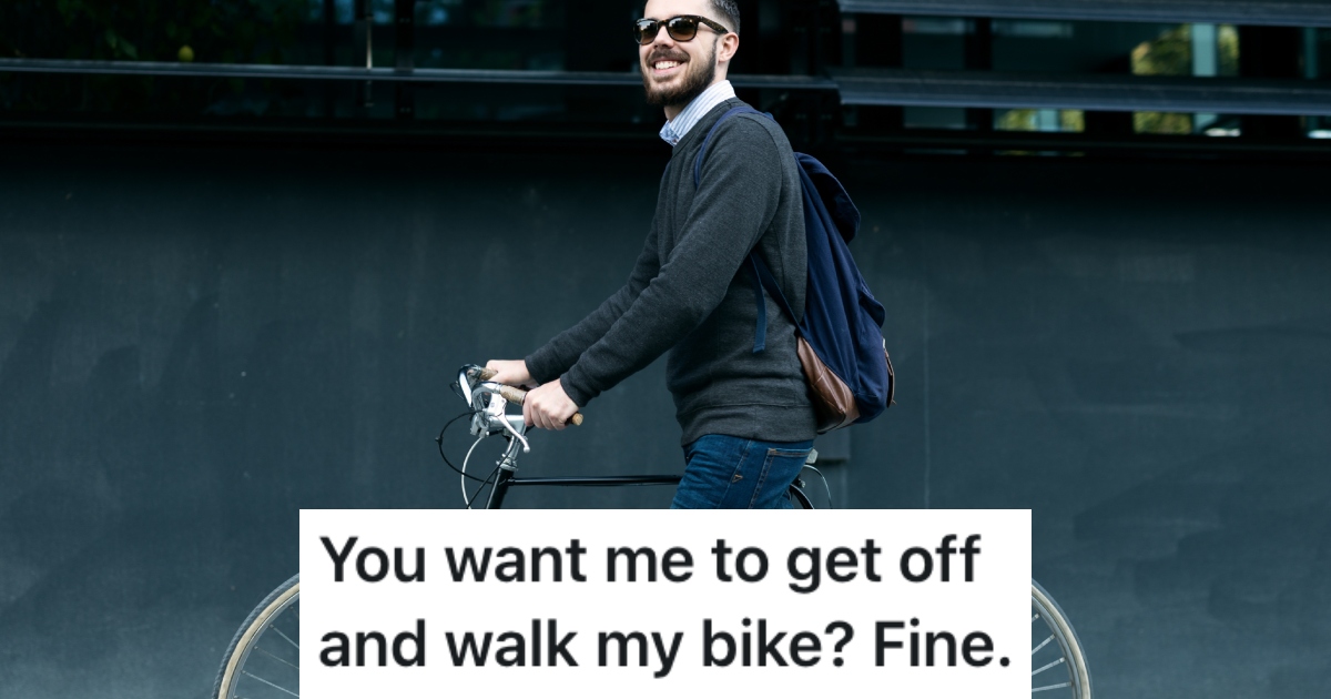 man walking his bike
