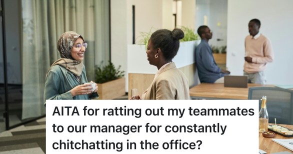 coworkers talking to each other by their desk