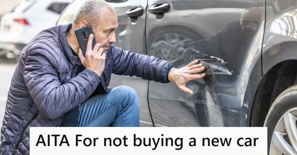 Man examining a dented car