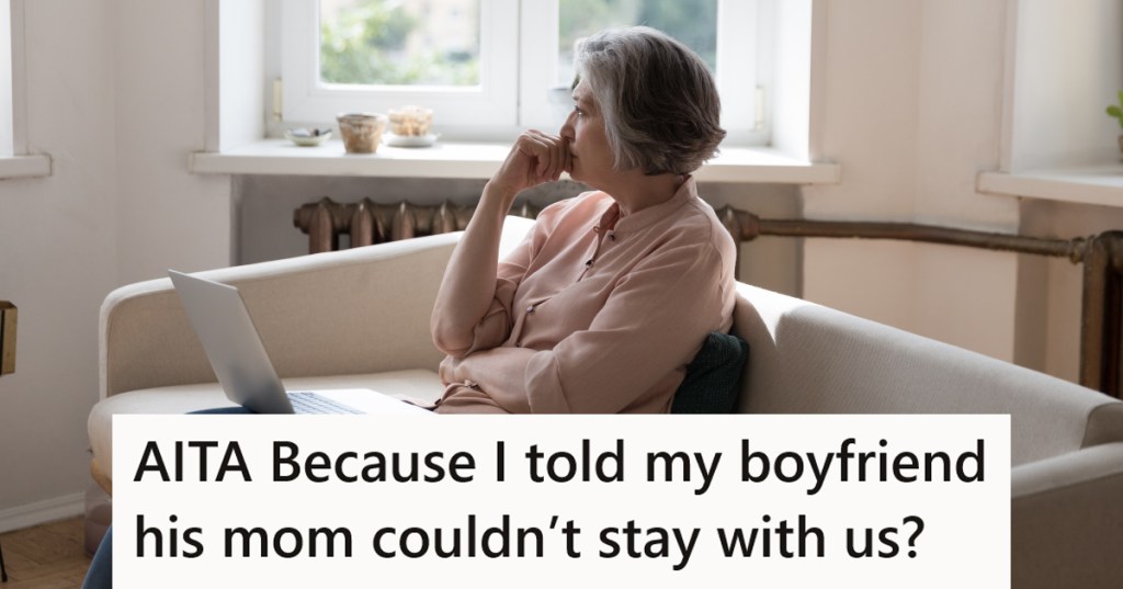 A worried looking women sitting on a couch