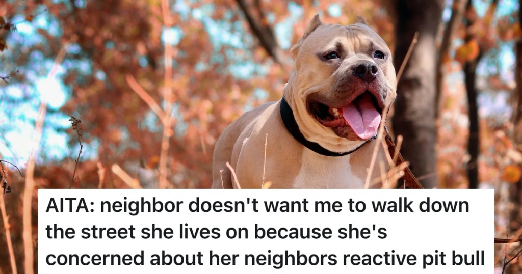 pitbull barking with fall leaves behind him