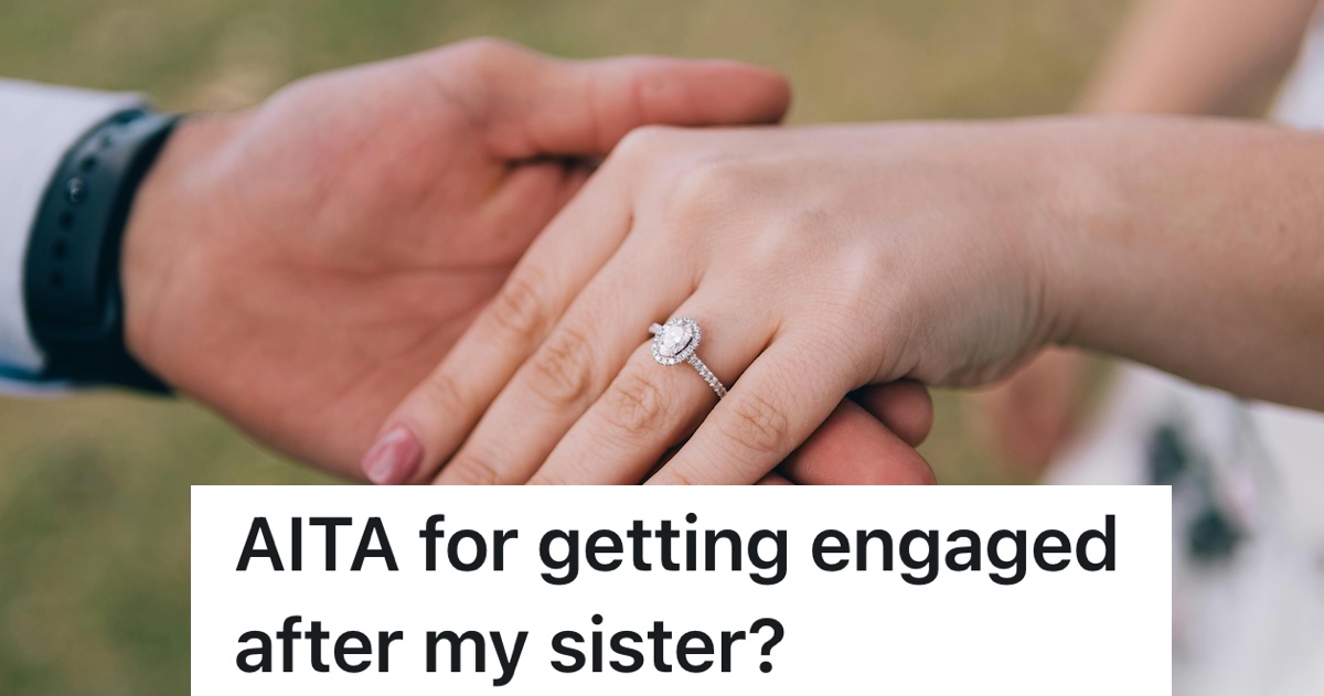 woman holding out engagement ring on ring finger