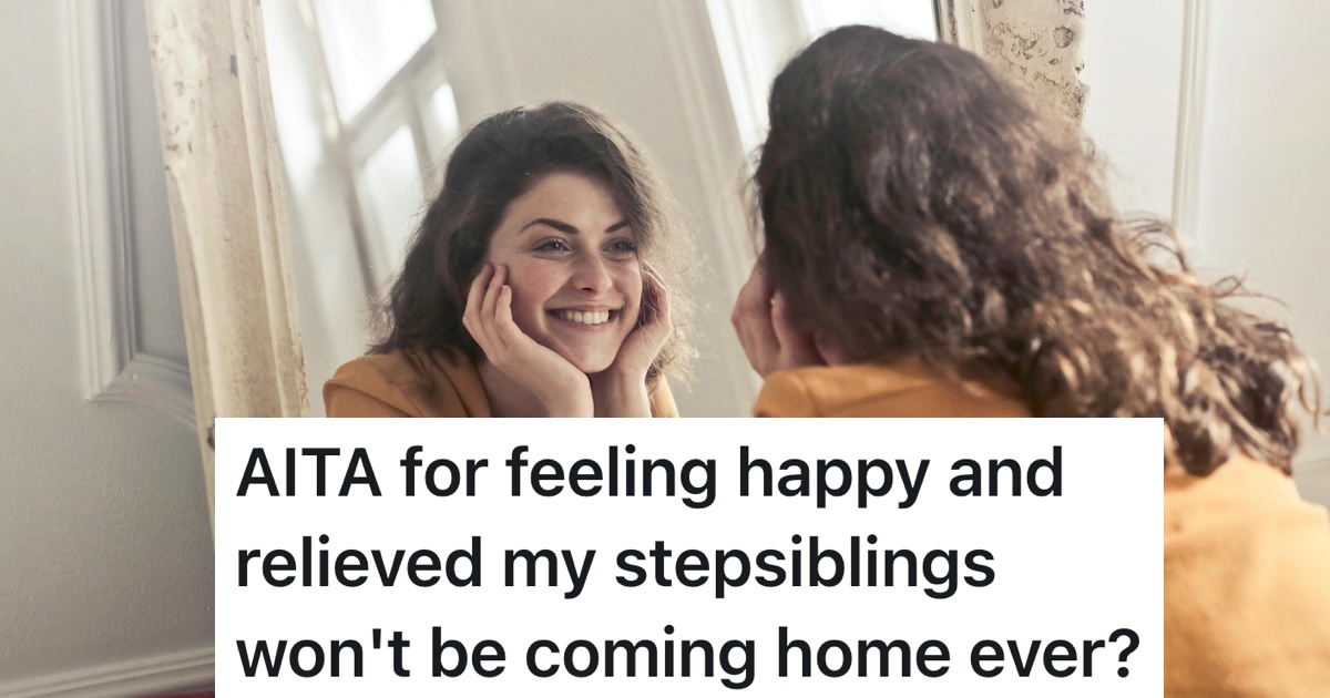 girl smiling while looking in the mirror