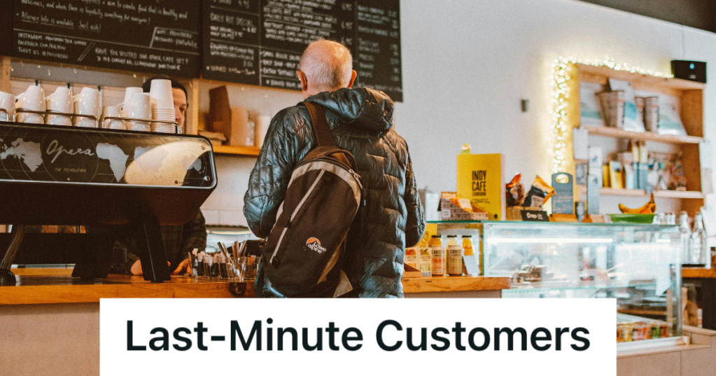 man standing in a sandwich shop