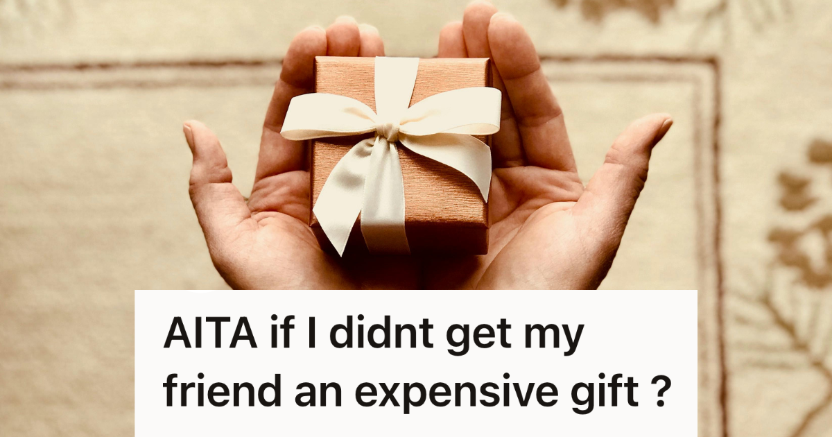 person holding small gift box in their hand