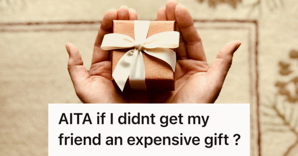 person holding small gift box in their hand