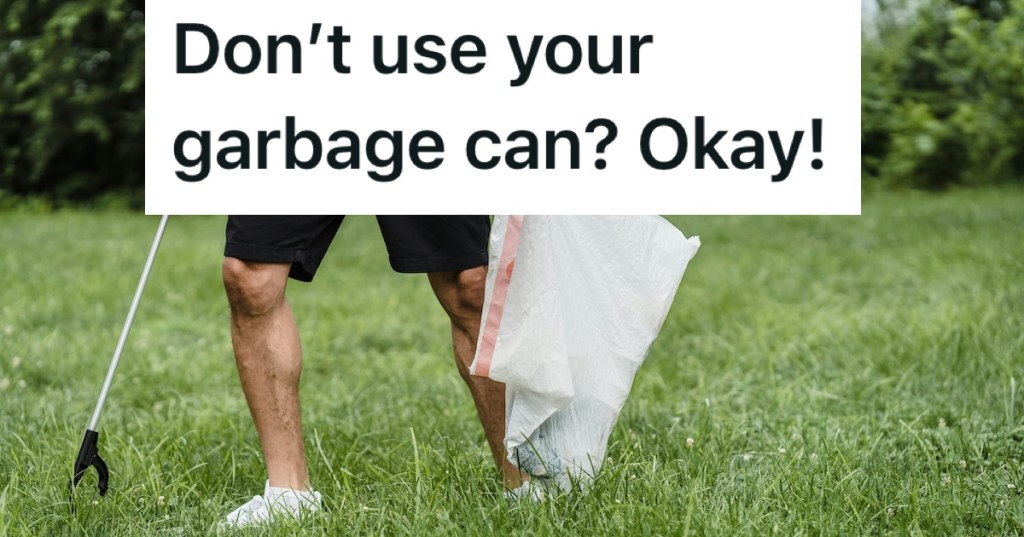 man picking up trash