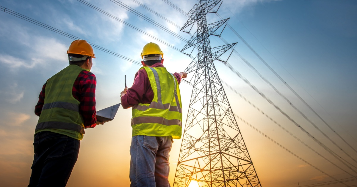 Workers looking at power lines