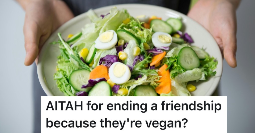person holding bowl of salad with vegetables in it