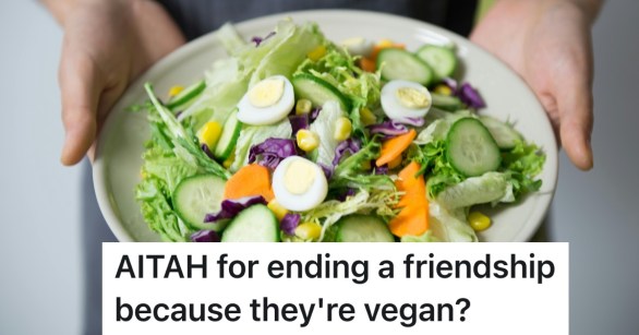 person holding bowl of salad with vegetables in it