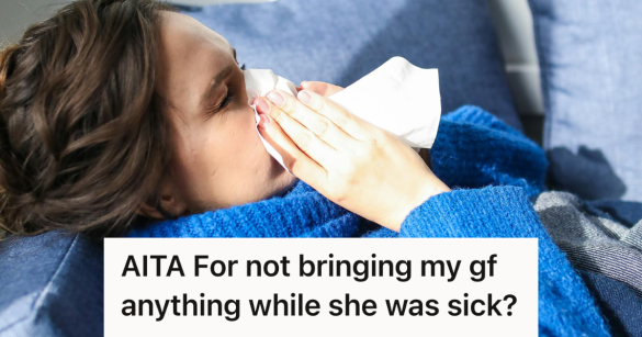 sick woman blowing her nose on the couch