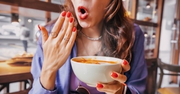 Woman eating spicy food