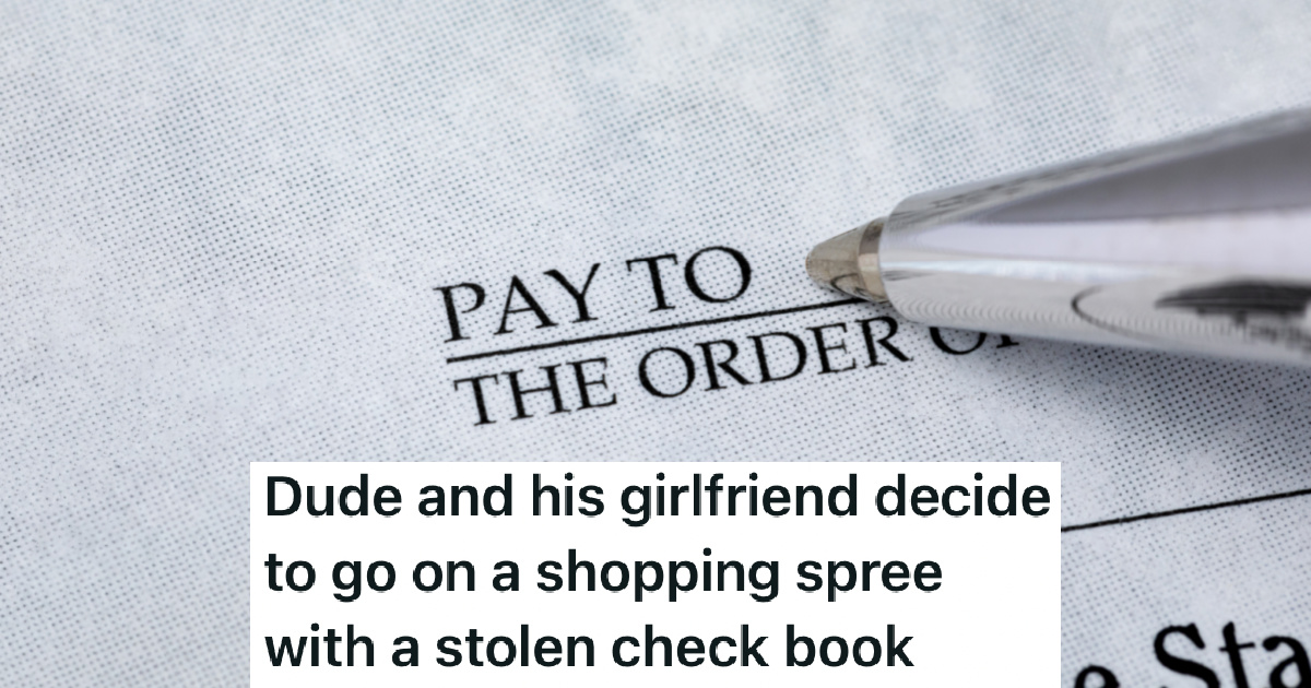 person writing out a check