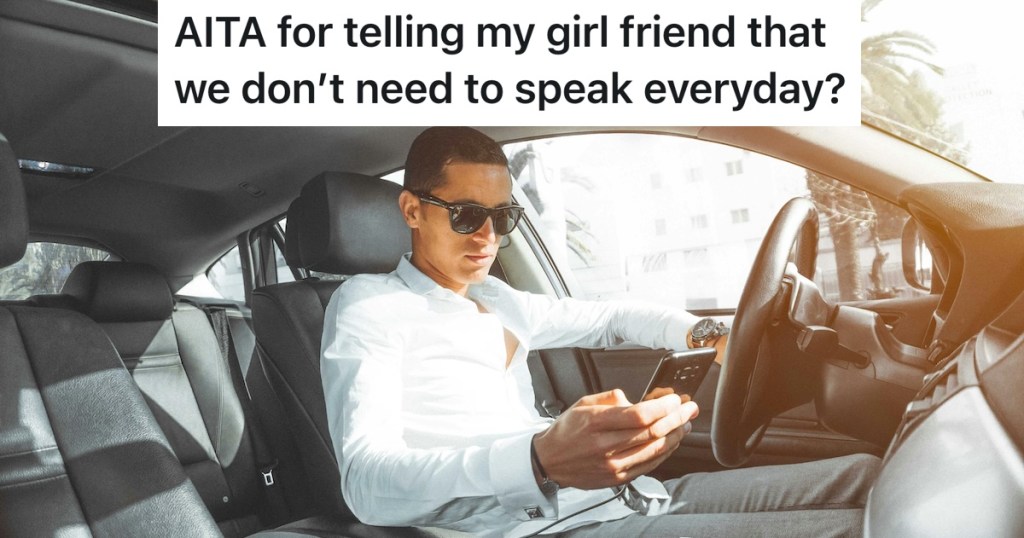 man texting in a car