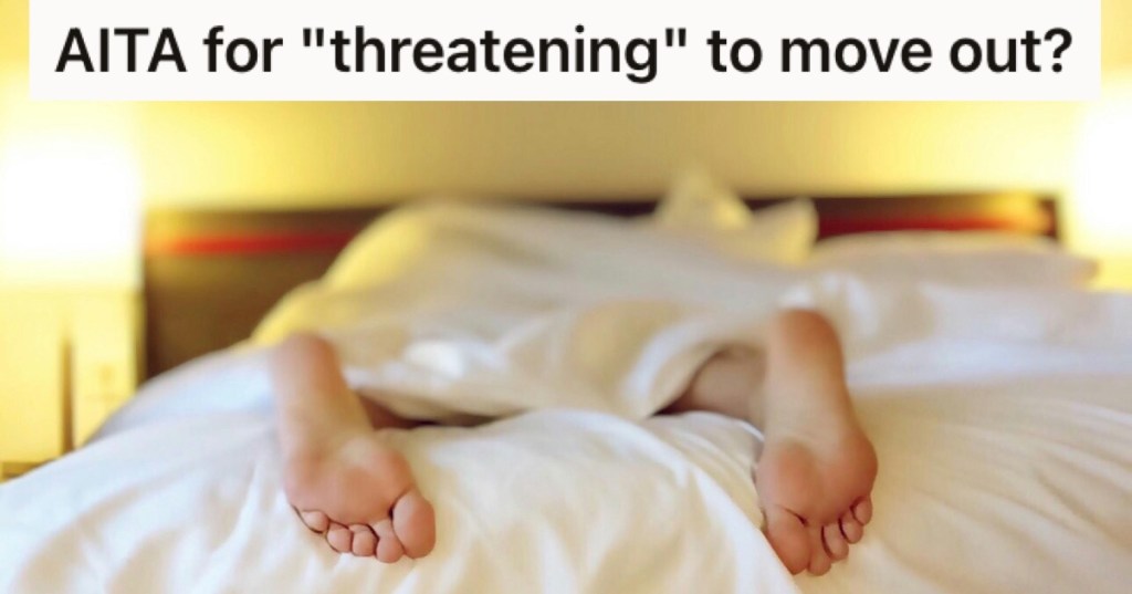 A pair of feet sticking out of a duvet