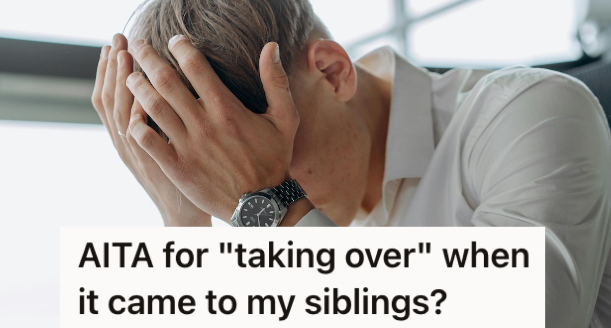 A man in a shirt with his head in his hands