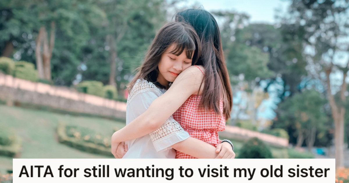 Two girls hugging in a park