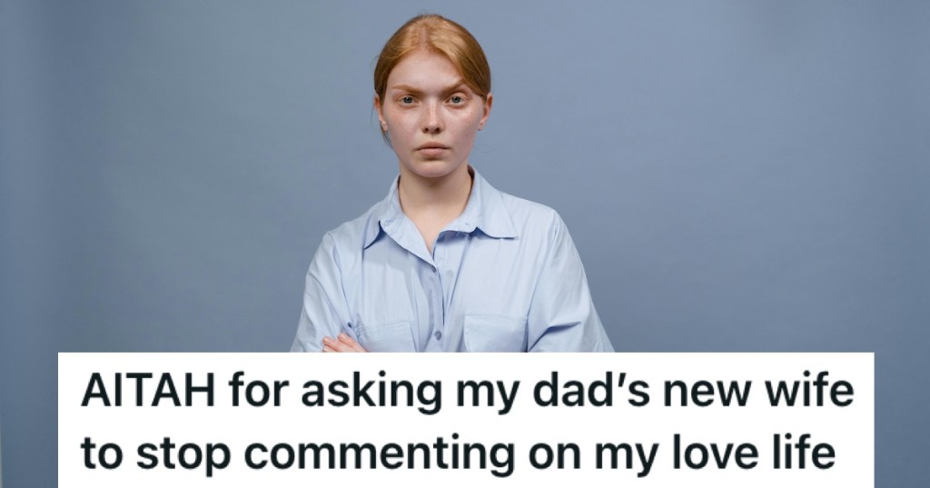 A woman in a blue shirt frowning