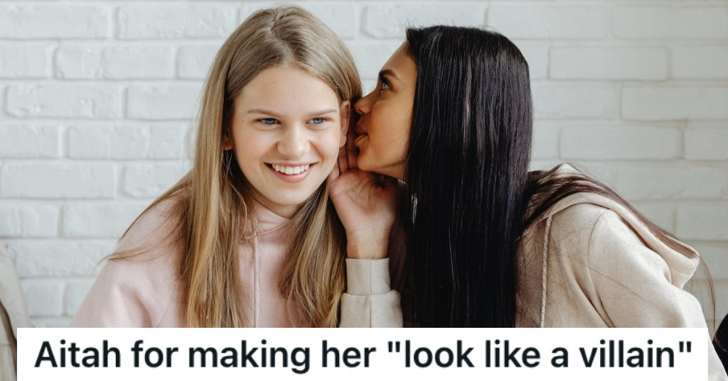 A girl whispering in her friend's ear