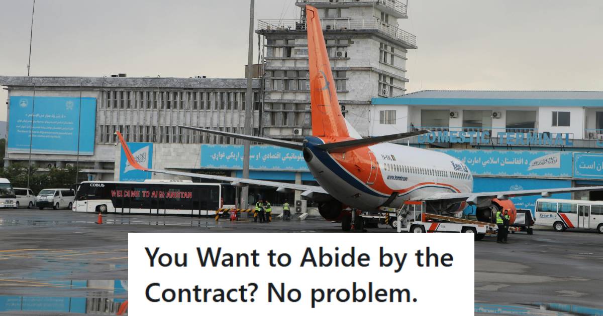 Large aircraft parked out front the airport with a colorful tail wing