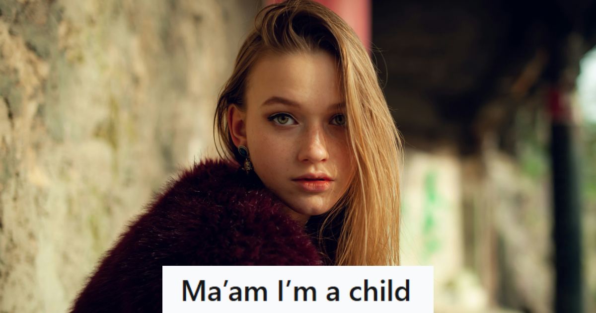 Teen girl wearing a puffy reddish-pink jacket posing for the camera