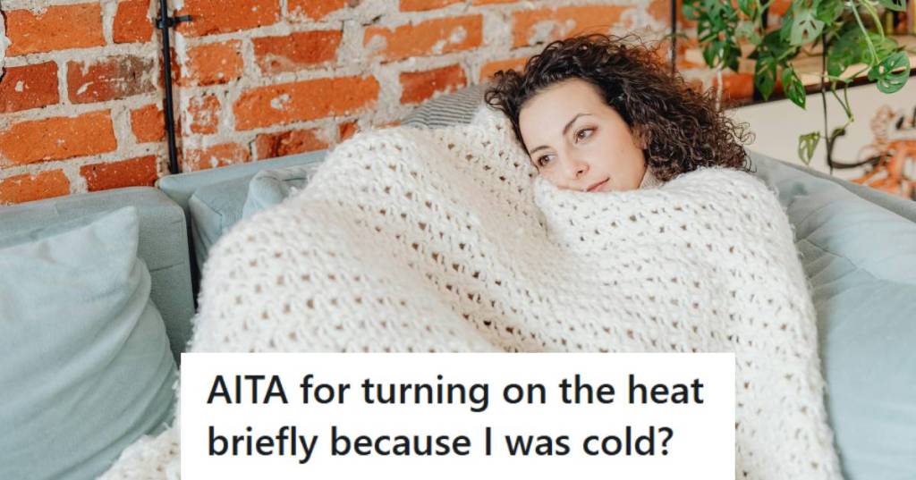 Woman freezing in her home bundled up under a blanket on the couch