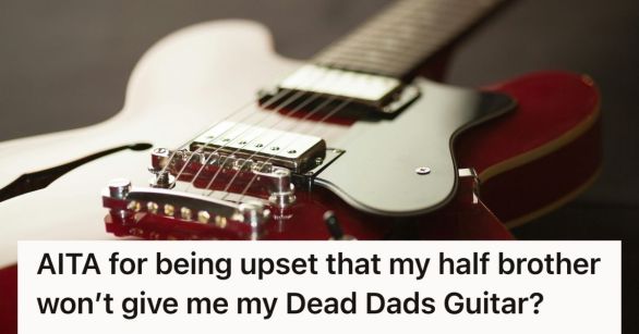 A bottom-to-top view of a red electric guitar