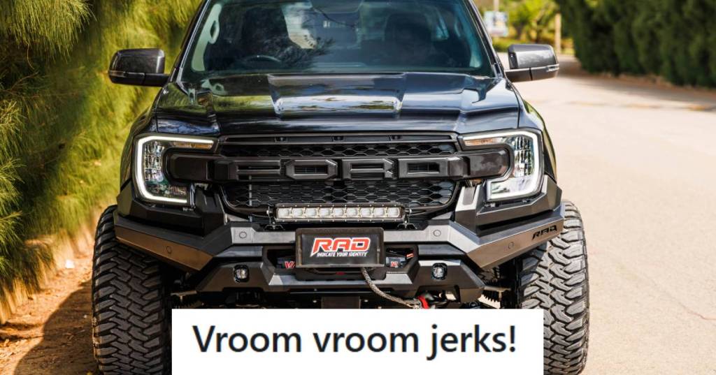 Black Ford F150 Raptor parked on this side of the street