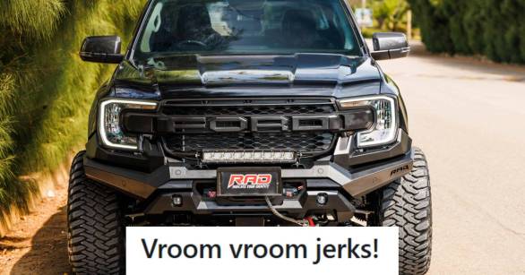 Black Ford F150 Raptor parked on this side of the street