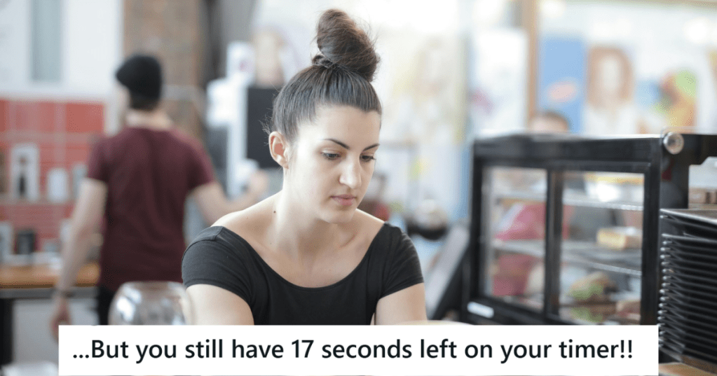 Woman in black outfit working in a cafe
