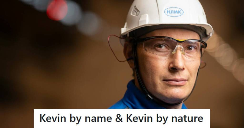 Man in a hard hat staring at his coworker in disbelief