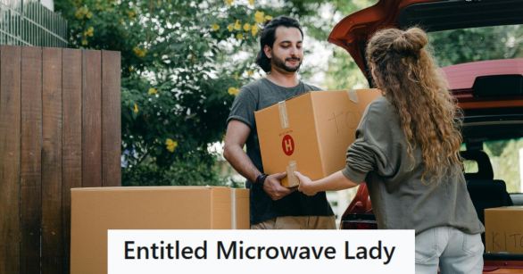 Man helping a woman carry a box that's too heavy for her