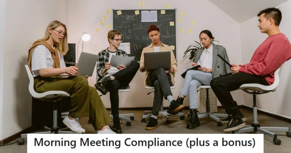 Group of coworkers sitting around waiting for a morning meeting to start