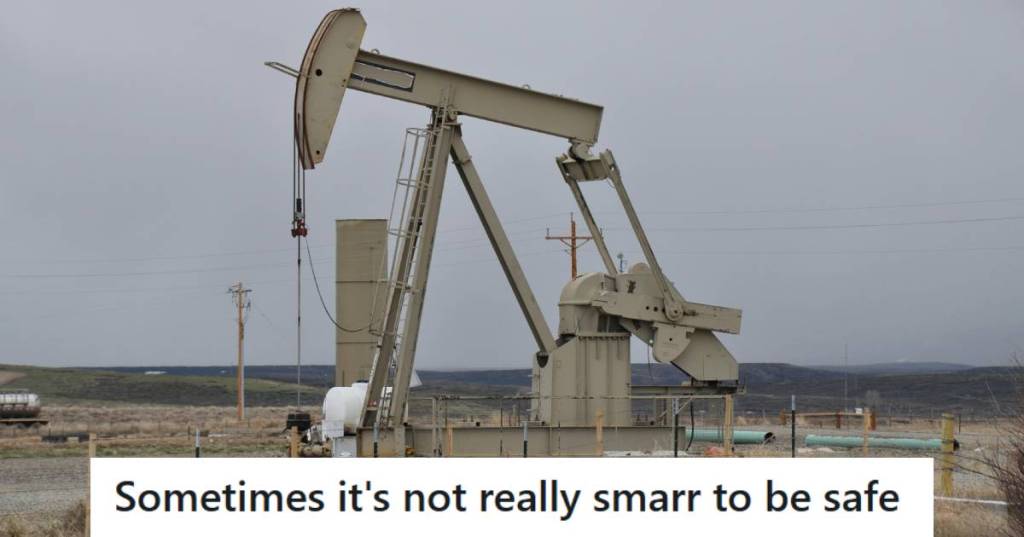 Large tan-colored oil rig in the middle of nowhere