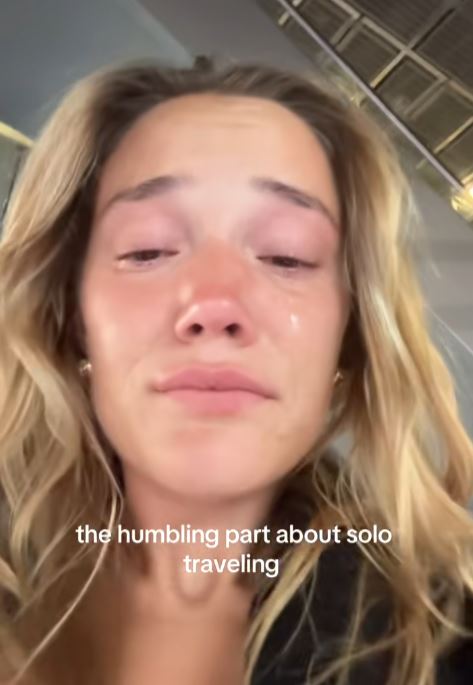 Woman crying at Paris airport