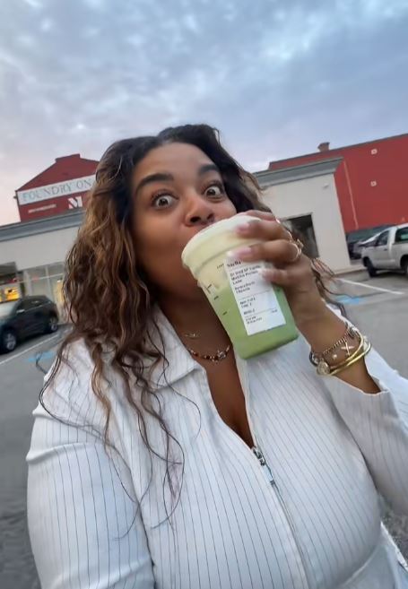 Woman trying Starbucks drink
