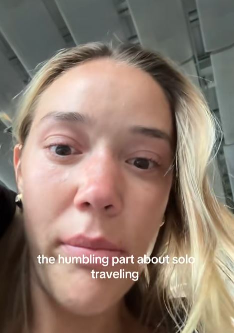 Woman crying at Paris Airport