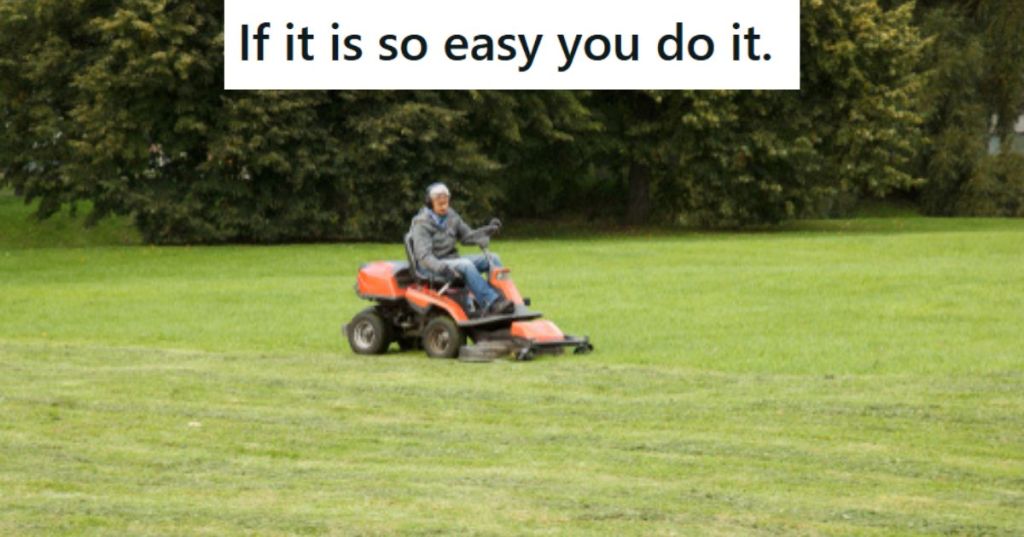 Man on riding lawn mower