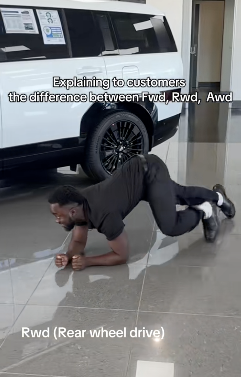 man in a car dealership