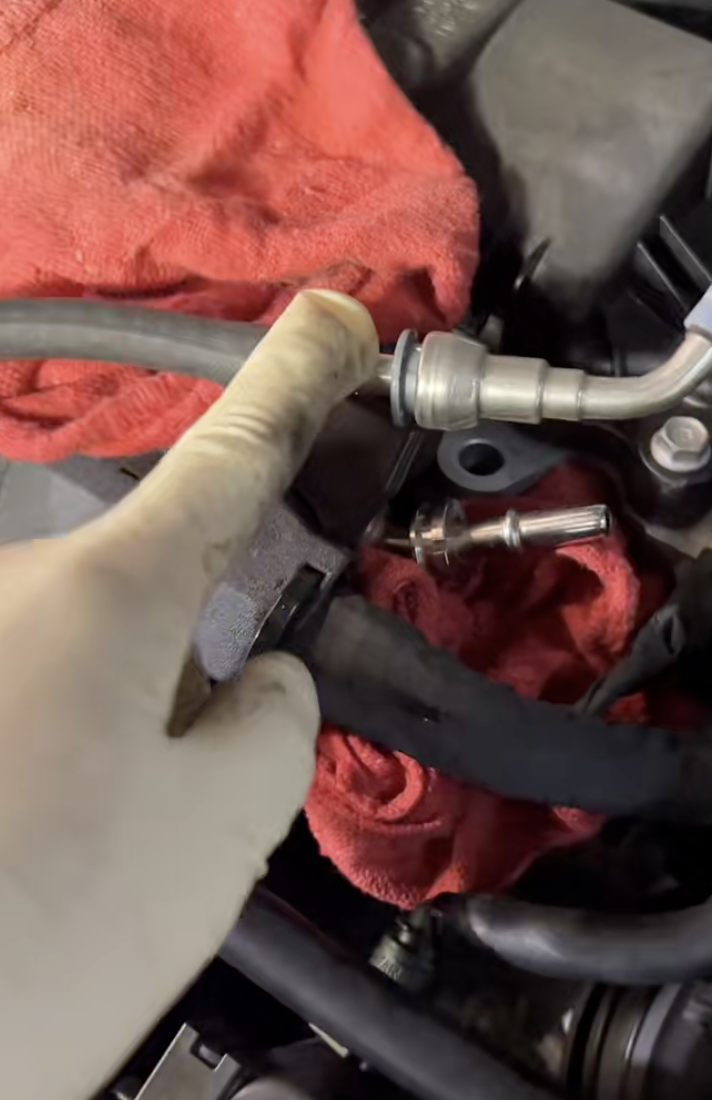 mechanic looking at an engine