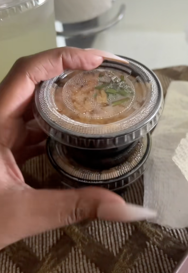 woman holding rice and beans