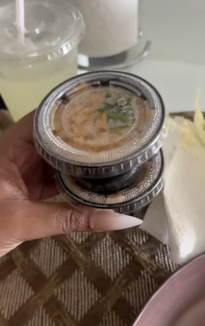 woman holding rice and beans