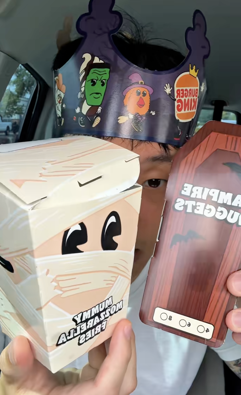 man holding burger king food