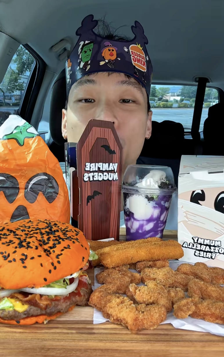 man with food from burger king