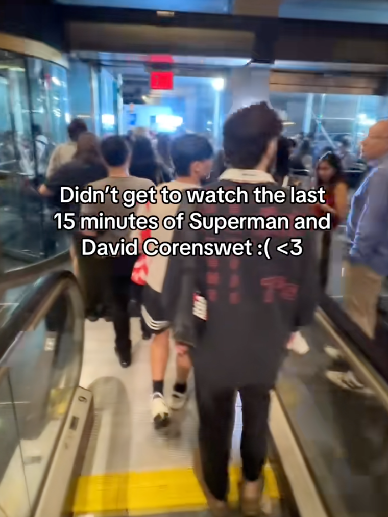 people walking out of a movie theater