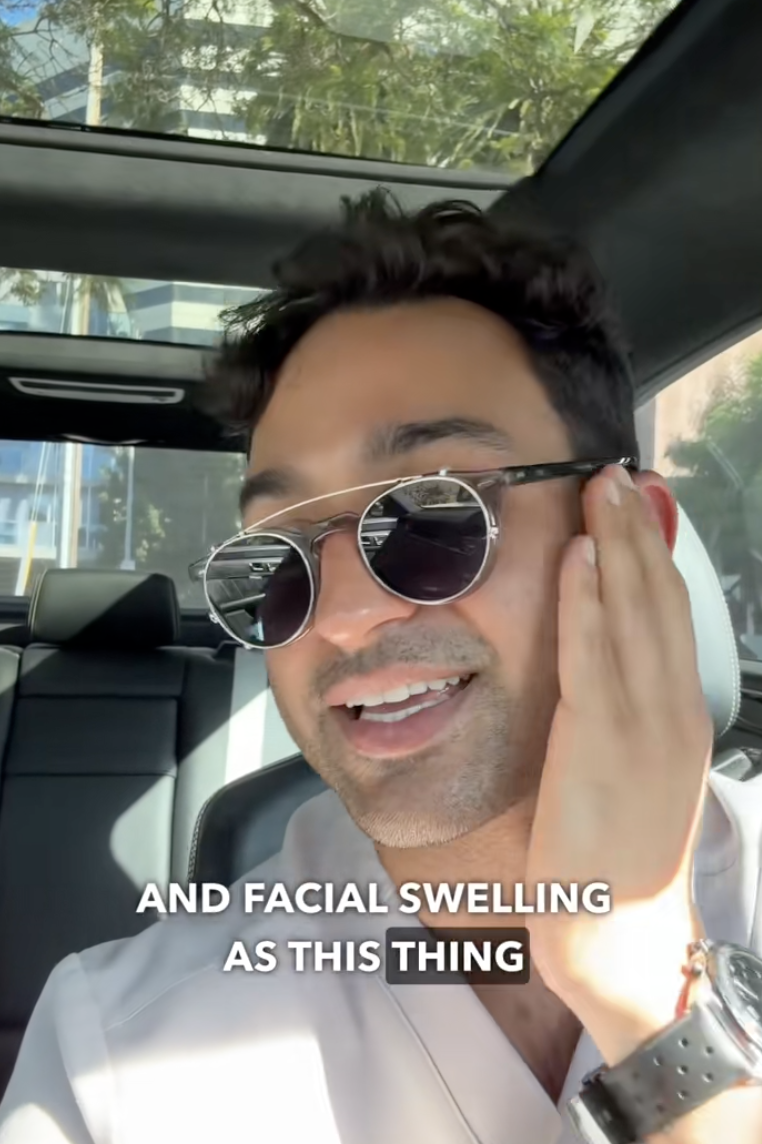 man sitting in his car