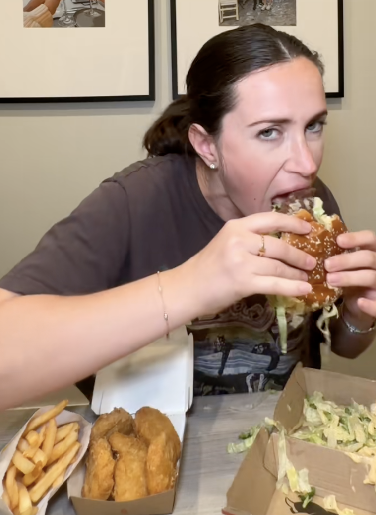 woman eating a big mac
