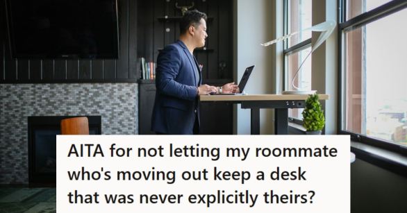 Young man using a laptop at a standing desk that belongs to his roommate