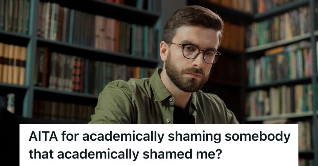 Male adult sitting at a table in a library